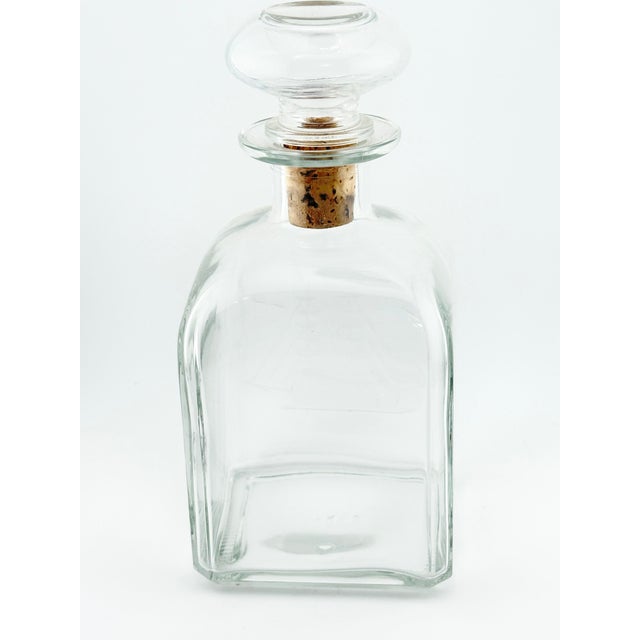 Lovely vintage Italian decanter. Made of glass with an etched sailboat on the front. Made in Italy. Perfect to use in a...