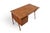 This desk was designed by G. Tibergaard Nielsen and produced by Tibergaard in Denmark during the 1960s. The teak case...