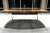 Early dining table having signature polished aluminum pedestal leg base and large 96” walnut veneer boat shaped top,...