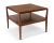 A pair of refined and versatile mahogany patchwork tables with shelves by Tommi Parzinger for Charak Modern, 1950's....