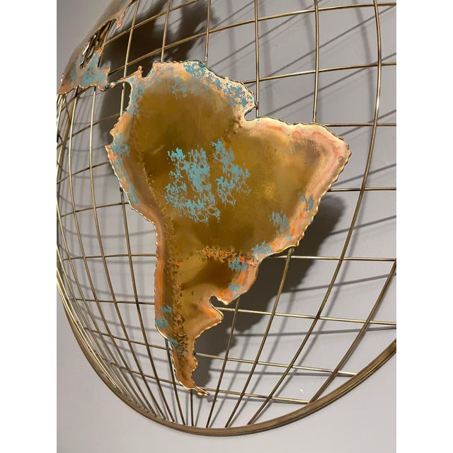 Pair of brass wall sculptures together forming 'The World' by Curtis Jere´ - This midcentury brass World Map was designed...