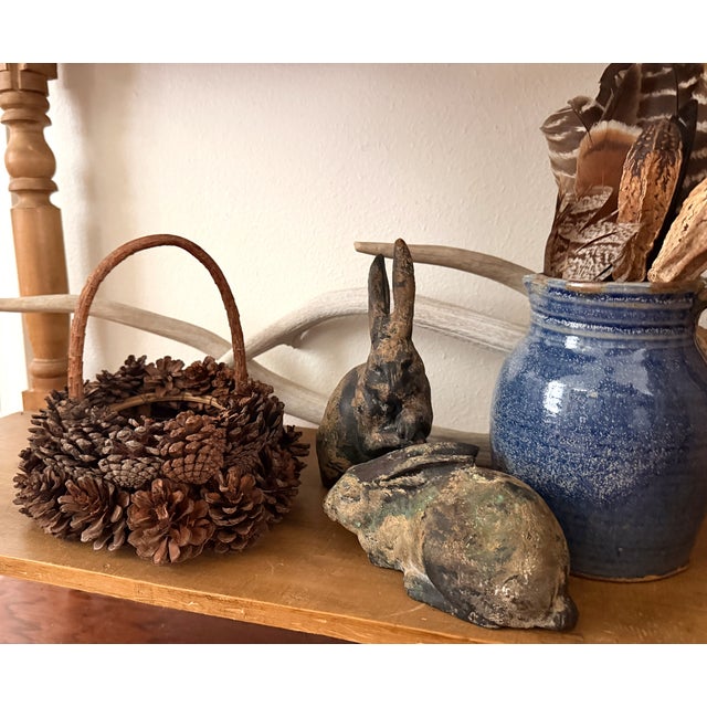 Wonderfully rustic and handmade pinecone basket. This basket was constructed with twigs, wire and rows of layered...