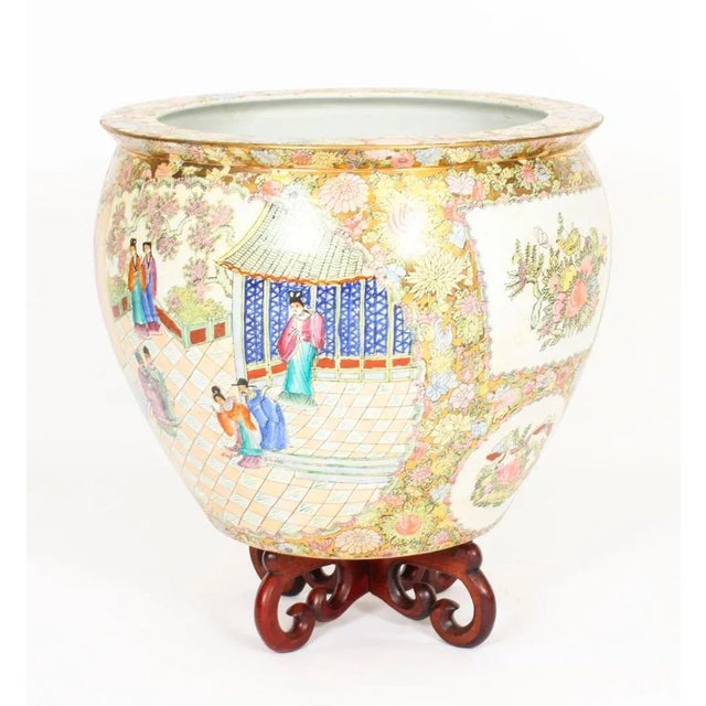 A beautiful pair of huge hand-painted porcelain vases / fish bowls on stands in the Chinese Qing Dynasty canton famille...