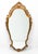 A nicely carved antique Italian mirror. The mirror is likely an early 20th century work (possibly late 19th C.) done in a...