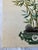 A single vintage hand embroidered cloth panel featuring an Asian style bamboo garden situated among rocks in a vessel....