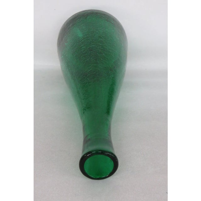 This gorgeous Bottle Decanter is made of crackle glass, and is in good condition. This beautiful piece has a lovely green...