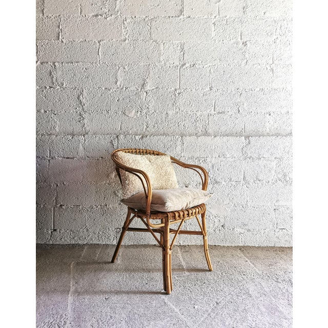 This delicate mid-century rattan chair dates from the 1960s and was made in Germany. Very good vintage condition, with...