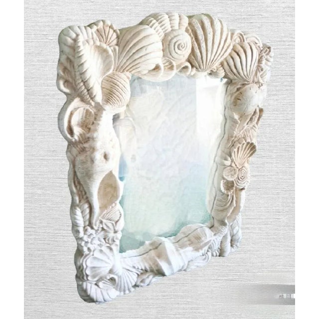 An incredible very rare and large plaster coastal sea shell wall mirror. This mirror is incredibly heavy. It features a...