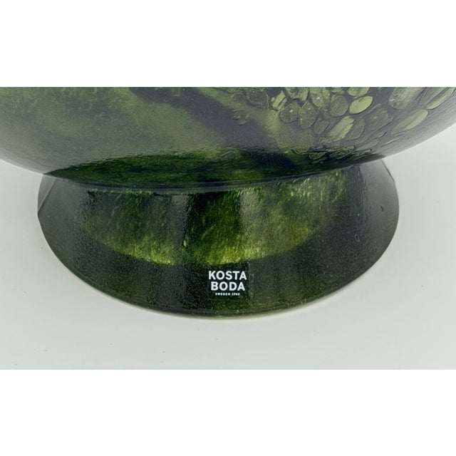 Discover this exquisite Kosta Boda "Corfu" art glass pitcher, a true masterpiece designed by the renowned artist Kjell...