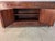 An elegant Ming-style sideboard by Baker, expertly crafted from solid mahogany and distinguished by its rich, finely...