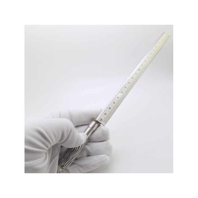 This vintage desk accessory serves as both a 20 cm graduated ruler and a letter opener. Handcrafted in solid 925 sterling...