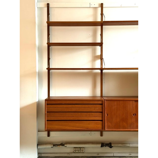 Poul Cadovius Royal System Wall Unit, Denmark, 1960s An original Royal System wall unit designed by the renowned Danish...