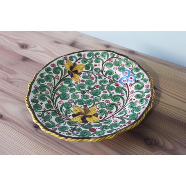 This decorative ceramic plate comes from the renowned Ars Deruta factory in Italy. It is distinguished by its hand-painted...