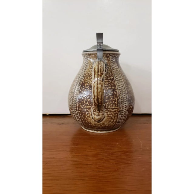 This beautiful Circa 1890 German Raeren Stoneware Lidded Jug with Tudor Style Rose Seal and measures 7 1/4" tall and 5...