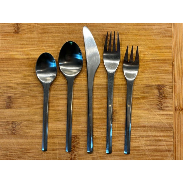 Jorgen Dahlerup and Gert Holbek "Prism" Stainless Flatware Set. Set includes 42 pieces, 5 pieces per place setting plus 2...