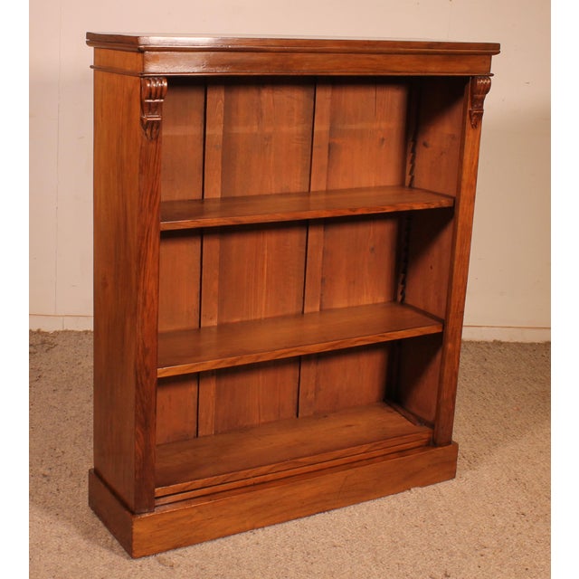 Charming small open bookcase in 19th-century English walnut. A very beautiful and unusual small piece, decorated with two...