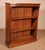 Charming small open bookcase in 19th-century English walnut. A very beautiful and unusual small piece, decorated with two...