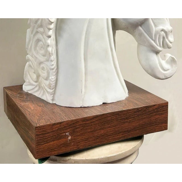 Stylized marble sculpture of a horse by the Italian sculptor, Amedeo Gennarelli (1881-1943), mounted on a wooden plinth...