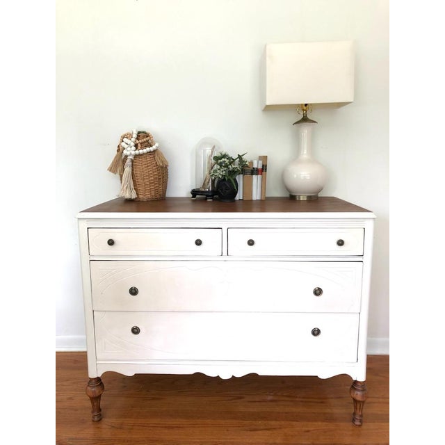 White painted american farmhouse dresser. The legs have been left in the matching wood color. So has the top. Inside the...
