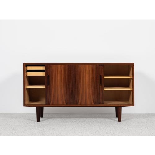 This sideboard is designed and manufactured by Hundevad & Co in Denmark in the 1960s. It shows good quality materials and...