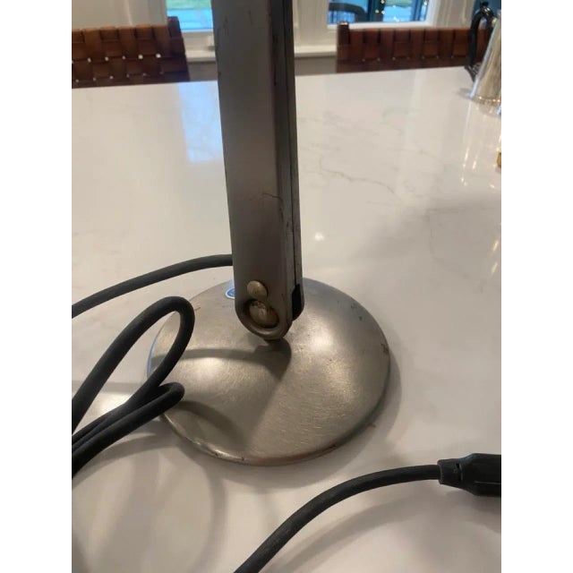 Model No. 1103B-ST Made in St. Louis, MO, U.S.A. Industrial style desk lamp brushed steel with adjustable head. Uses...