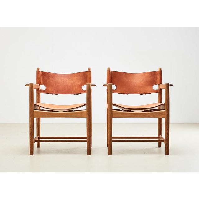 Classic pair of model 3238 'Spanish Hunting' chairs, designed by Borge Mogensen in 1964 for Fredericia Stolefabrik...
