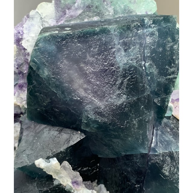 A monumental natural Fluorite specimen selected for its rare dual-sided visual character, sculptural scale, and strong...