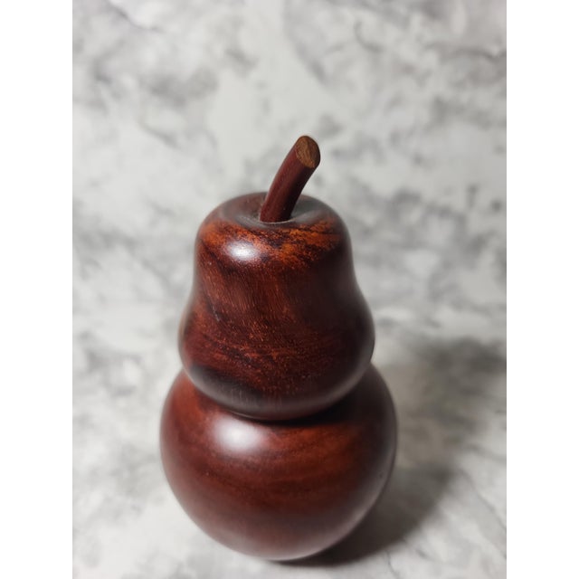 This beautiful wood carved pear holds toothpicks, bobby pins or anything else that fits inside. The wood is sleak and...