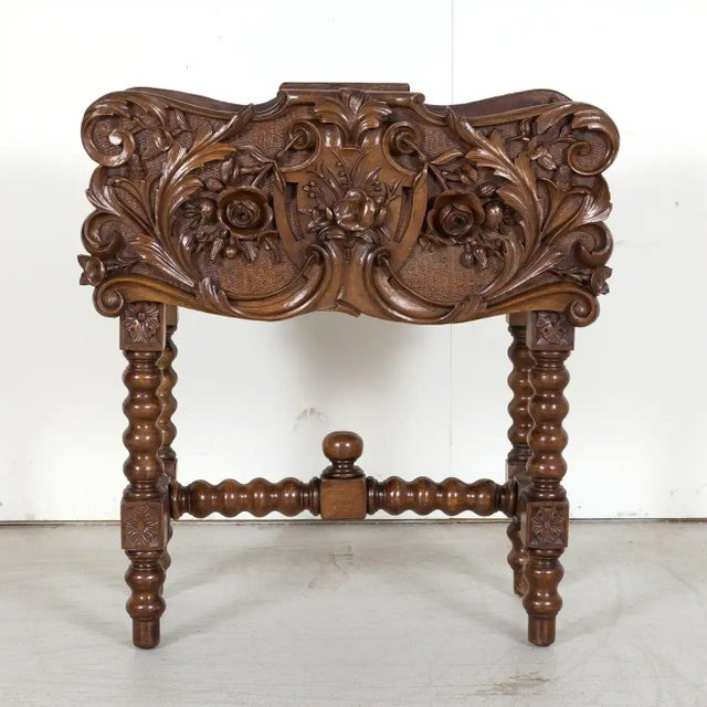 A 19th century Black Forest jardinière hand carved of solid walnut in the Alsace region of France, circa 1870s. The...