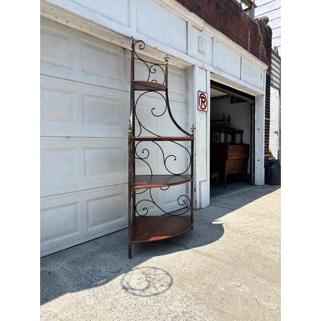 We have a beautiful Drexel Heritage corner etagere for sale. It features wrought iron scrollwork, Tuscan Revival styling,...
