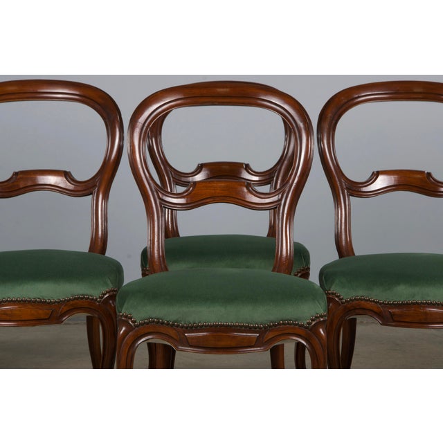 An elegant set of six late 19th-century country French provincial dining chairs made in the style of Louis XV, sourced...