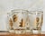 A set of four gold trimmed juice glasses and decorated with stylized leaves. Ships within 1-2 days using USPS. All items...