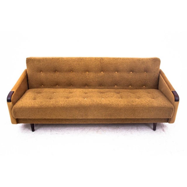 Original sofa made in Denmark in the 1960s. After restoration. The sofa has been covered with a new yellow bouclé fabric....