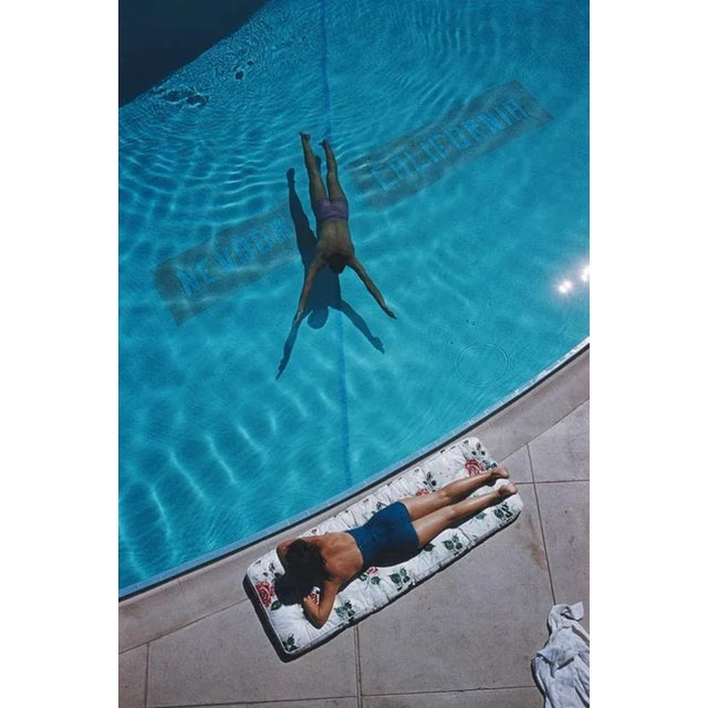 Swimmer And Sunbather 1959 by Slim Aarons Slim Aarons Limited Estate Edition An underwater swimmer and a sunbather at Lake...