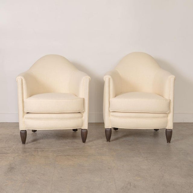 Lovely Art Deco club chair from France, 1930s. Beautiful curved wood frame with carved detail on feet. Newly upholstered...