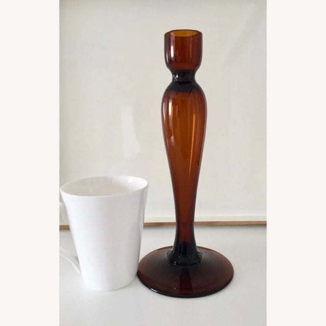 Mid-century elegant simplicity and good quality thick glass make it a very nice decorative object. It's very possible that...