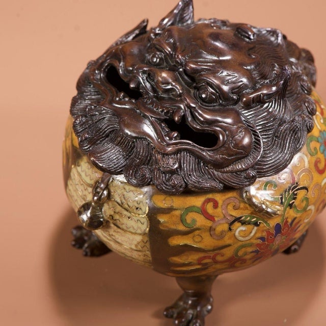 This is a substantial antique cloisonné enamel censer (incense burner), featuring a rounded, globular body supported on...