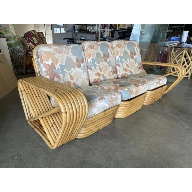 Restored Art Deco 8-strand rattan square pretzel arm sectional sofa with seating for three people. The sofa features Paul...