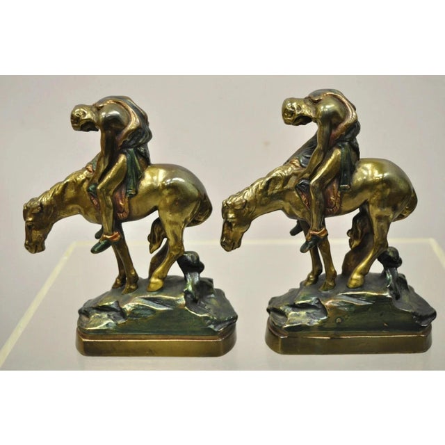Vintage Bronze Clad 8" End of Trail Indian on Horse Figure Bookends - a Pair. Item features original blue and red paint,...