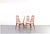 The set of four "Eva" chairs, designed in the 1960s by Niels Koefoed and manufactured by Koefoed Hornslet, is an example...