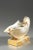 White porcelain inkwell in the form of a shell, highlighted with gold and resting on a square base. The top features two...
