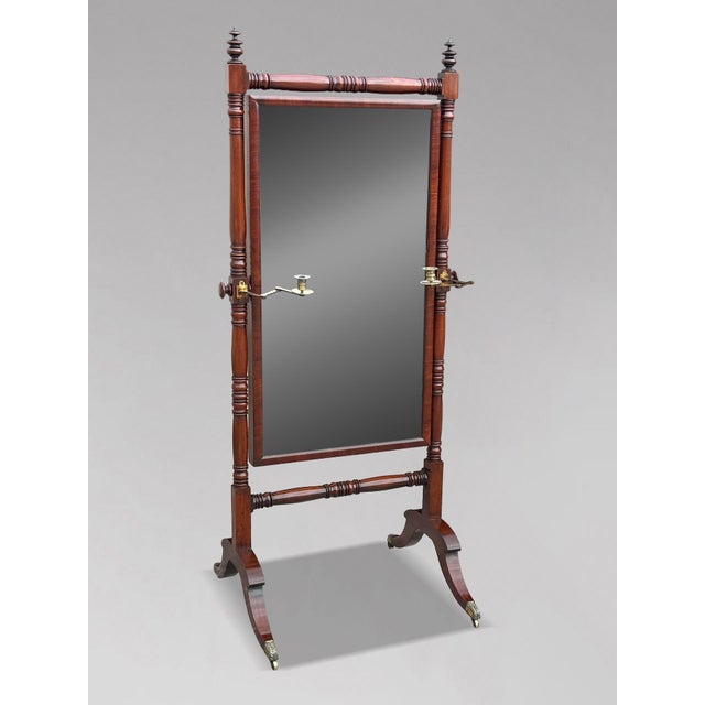 A magnificent and highly impressive early 19th-century Regency period cheval dressing mirror, crafted in superb quality,...