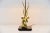 Very nice shaped deer head table lamp made in France, 1975. This lamp has a black lacquered wooden base and a brass...