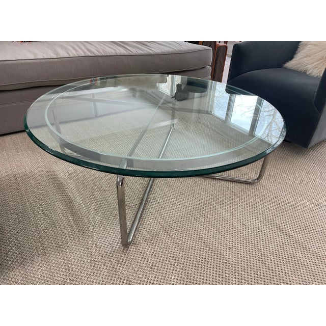 This was purchased from Bloomingdales 25 years ago. This is exactly 4 ft wide. The glass is very thick.