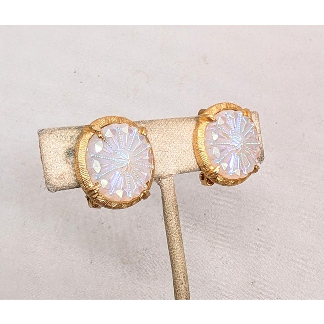 1960s round goldtone with prong set round white iridescent raised pattern rhinestone center clip earrings with comfort...