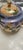 Elegant lusterware porcelain tea set with a hand-painted bird and landscape motif. This set includes a teapot with lid,...