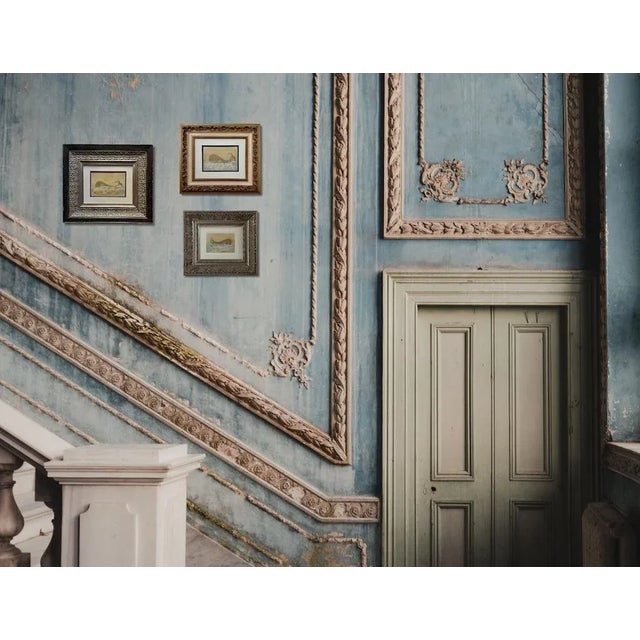 Folk art watercolor of a stylized whale riding soft, curling waves beneath a glowing ombré sky. Executed in a primitive...