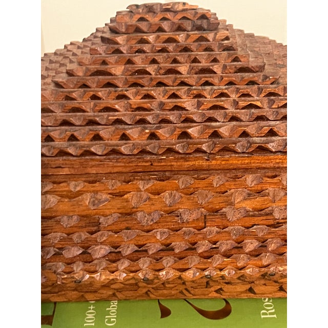 A wonderful example of American folk art, this Tramp Art box is constructed from a repurposed cigar box, layered and hand...