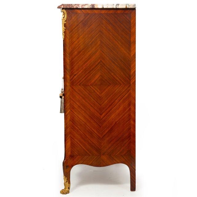 KINGWOOD AND GILT-BRONZE MOUNTED MARBLE-TOP BIBLIOTHÈQUE CABINET WITH GRILLWORK DOORS Probably France, circa 1890 43 1/2"...