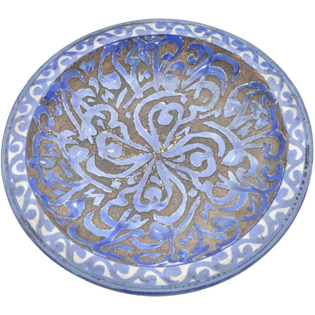 Late 19th Century handcrafted and glazed Moroccan ceramic plate. Featuring an elaborate hand-painted Arabic calligraphy in...
